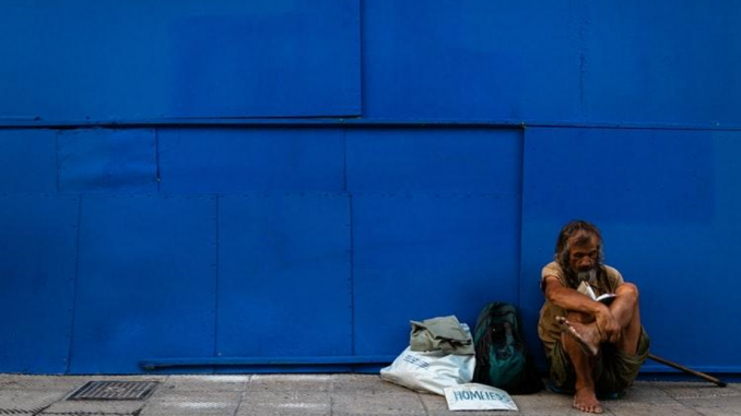 Homeless Man Reading