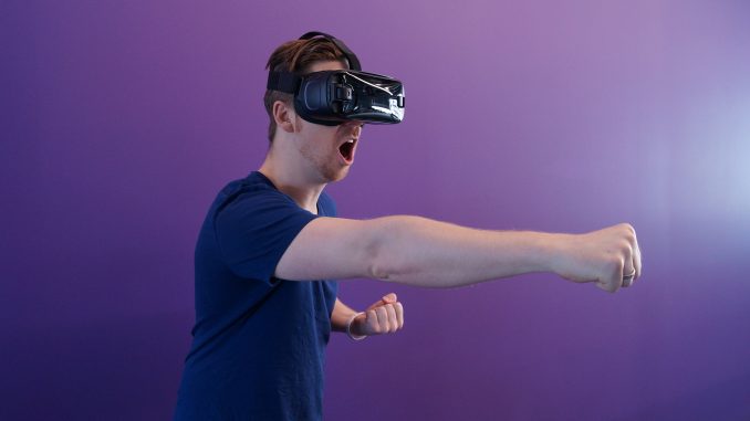 man-using-virtual-reality-headset-doing-an-action-1261820